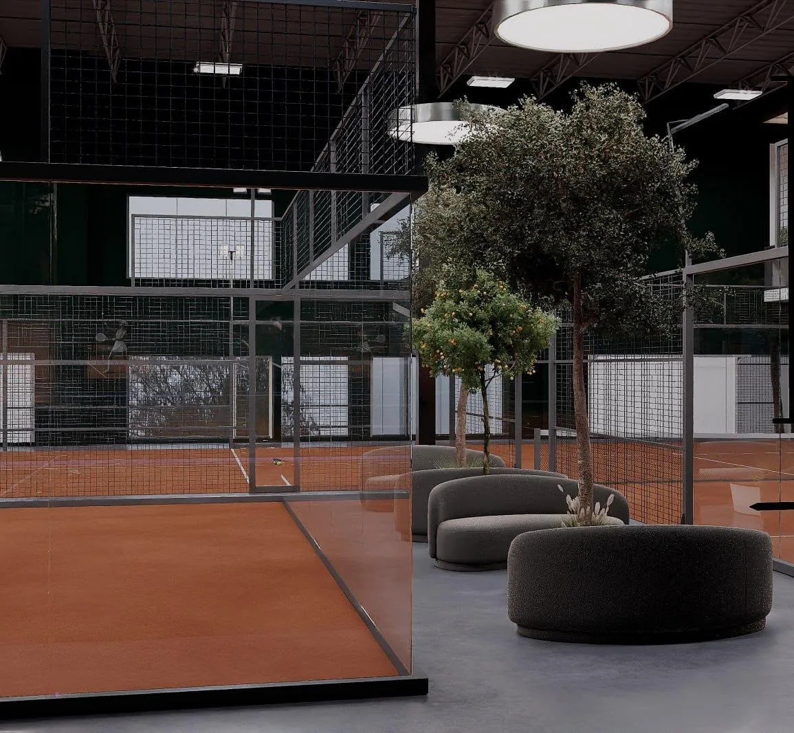Lounge seating and olive trees beside the glass wall of a padel court at Padel Model